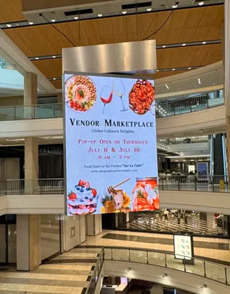 LED Video Wall display hanging in San Francisco Centre promoting Global Marketplace event.