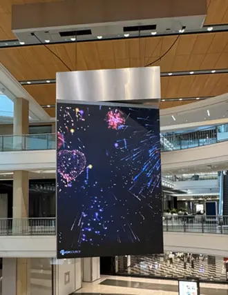 LED Video Wall display hanging in San Francisco Centre mall showing fireworks motif for Fourth of July.
